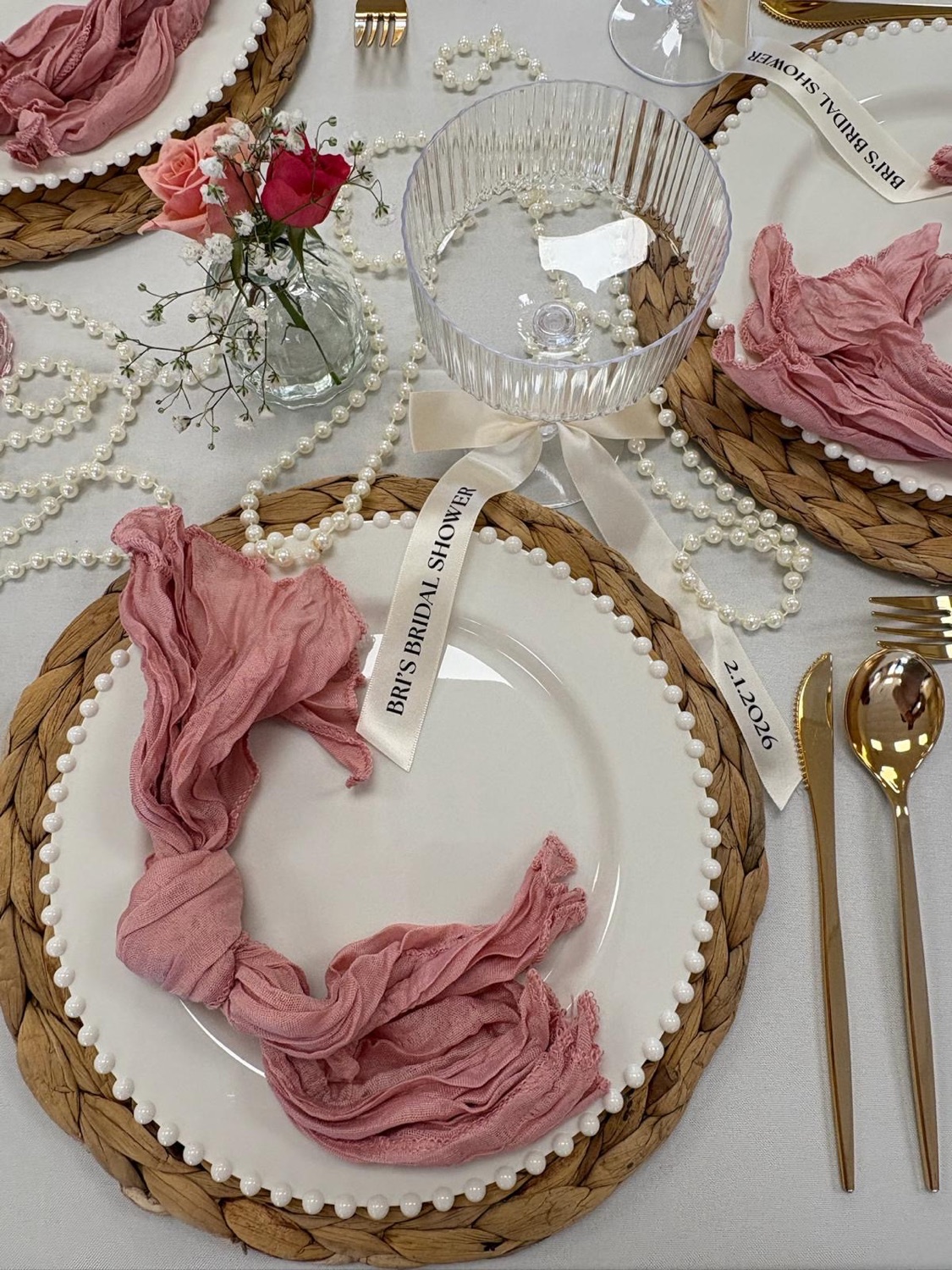 Blush napkin and gold charger place setting